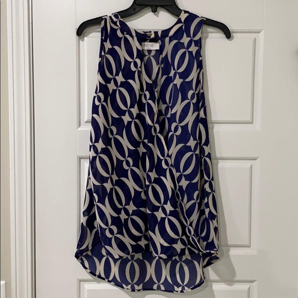 Navy blue and beige high-low sleeveless blouse
